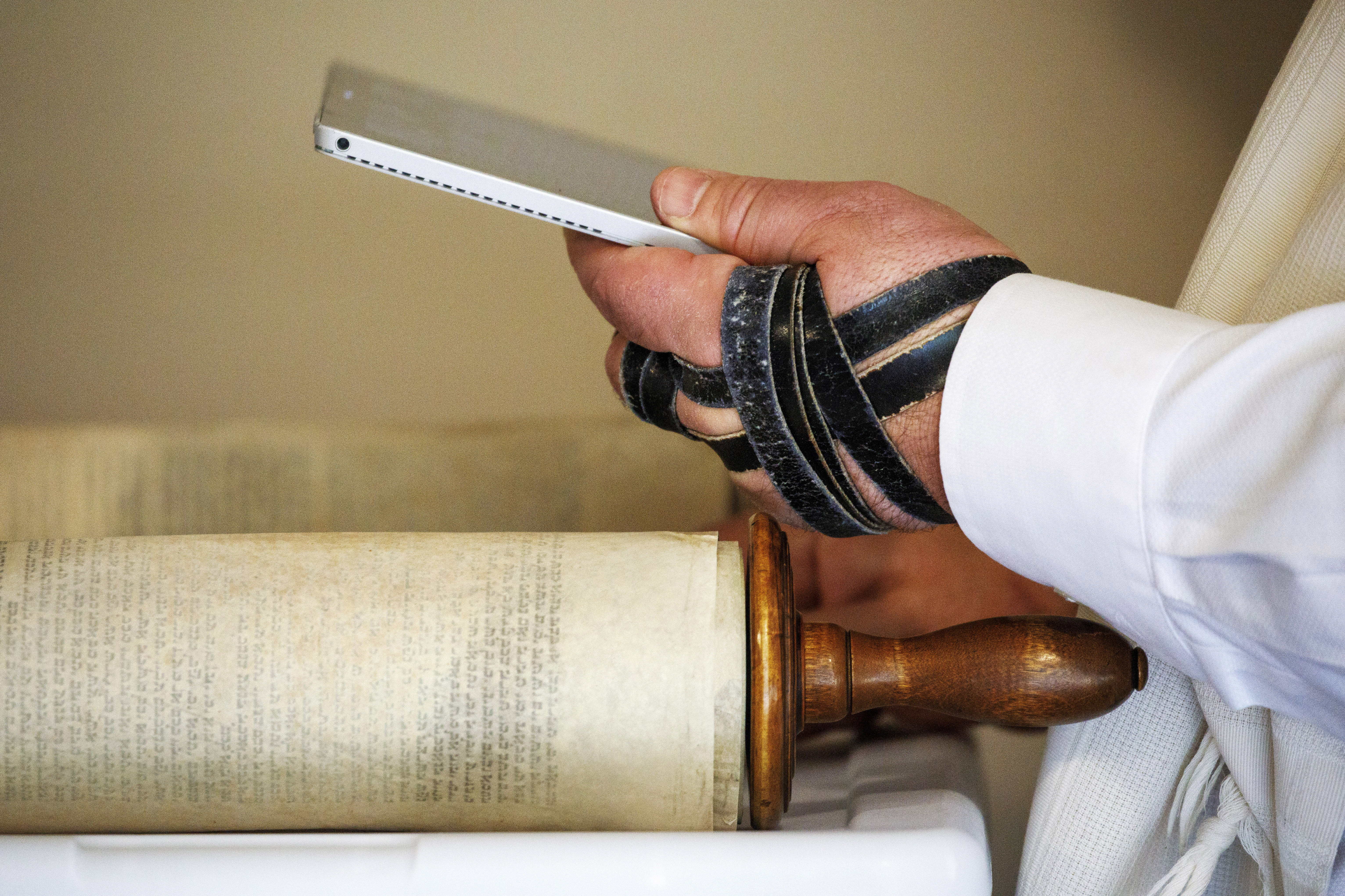 Rabbi Haim Ovadia reads the Torah to people attending a Zoom meeting of a virtual minyan from his Maryland home in 2020.